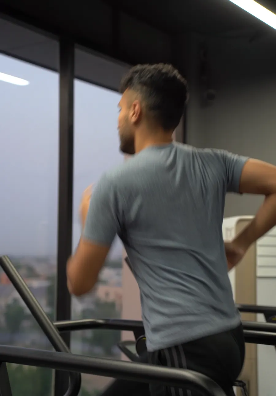 Member training on a cable machine beside the window at Fitnation Gym